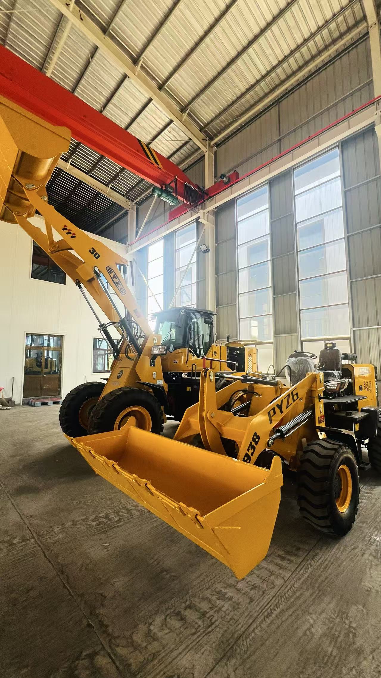 Wheel loaders inside factory