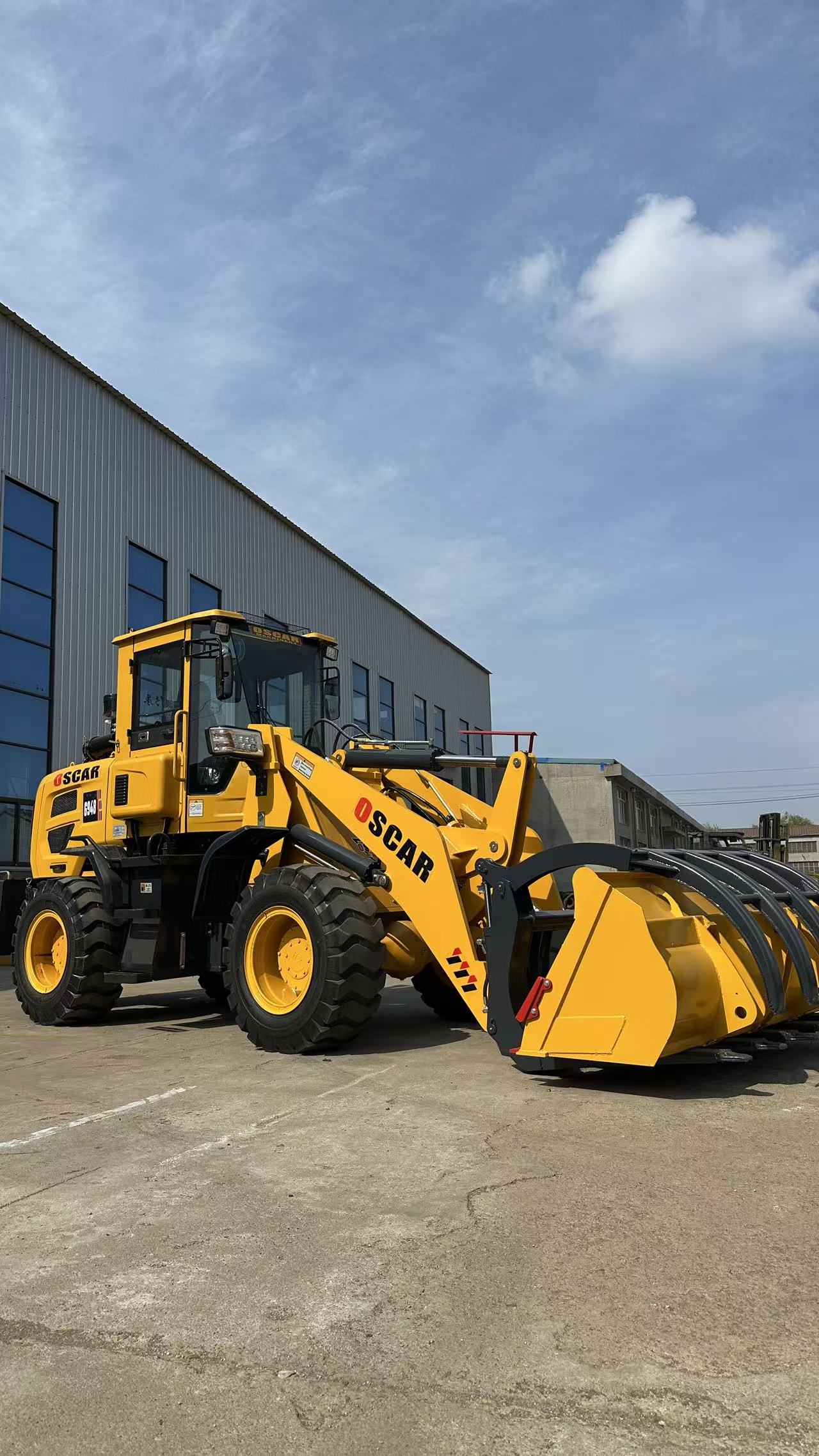 Front view of yellow wheel loader with bucket